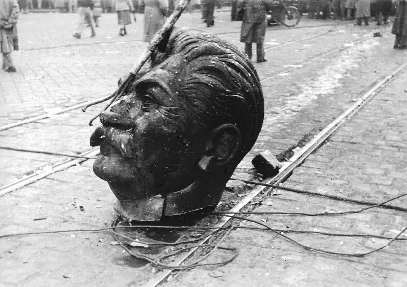 The severed head of Joseph Stalin’s toppled monument lies in a Budapest street during the Hungarian Revolution, October 1956. (Keystone/Getty Images)