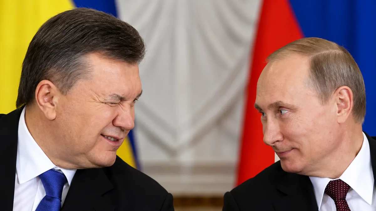 Ukrainian (former) President Viktor Yanukovych winks at Russian president Vladimir Putin at a Russian-Ukrainian interstate commission in the Kremlin. December, 2013 (Sergei Karpukhin/Reuters).  