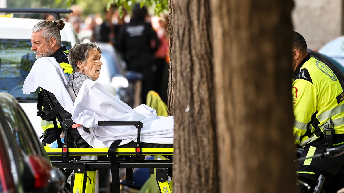 Maricarmen is seen lying on a stretcher following her eviction from her home in Madrid early on Wednesday afternoon (Álvaro García/El Pais)