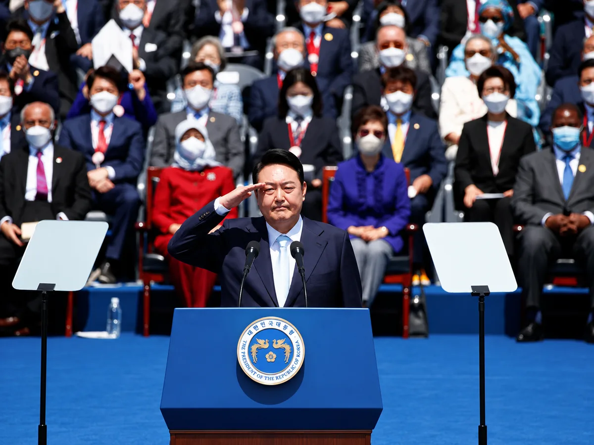 South Korean President Yoon Suk-yeol salutes during his inauguration in front of the National Assembly in Seoul (Jeon Heon-Kyun /Reuters)