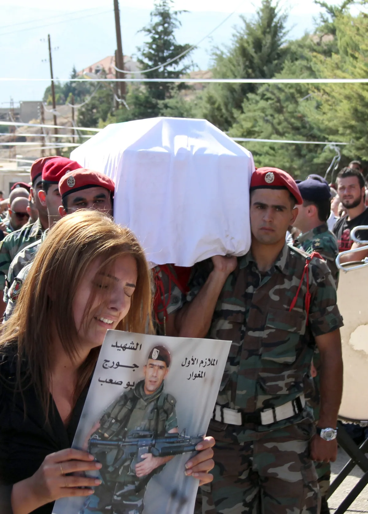 Lebanese mourners carry the coffin of First Lieutenant George Bou Saab on June 25, 2013 [Getty]