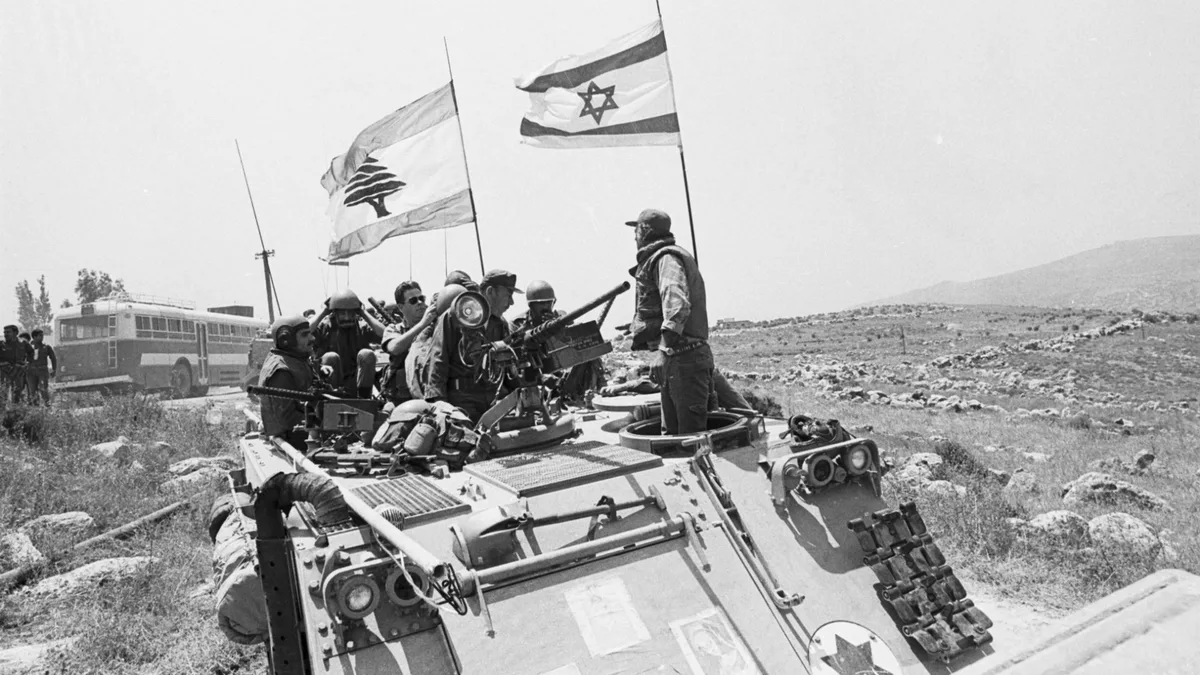 South Lebanon Army fighters atop an armored vehicle in southern Lebanon during the 1982 war (Alain Mingam/Getty Images)